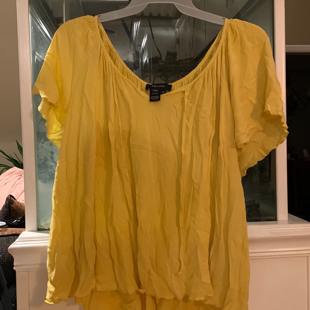 Karen, Kane light yellow shirt